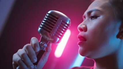 Female Singer Performing with Retro Microphone in Neon Light - Powered by Adobe