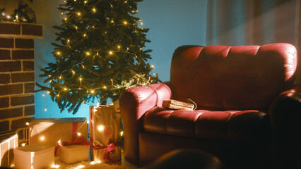 Sofa Next to the Christmas Tree at the First Light of Christmas Dawn In The Room