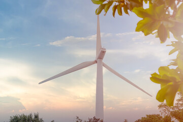 Wind turbines and Solar panels park at sunset.Windmill turbines generating green energy...