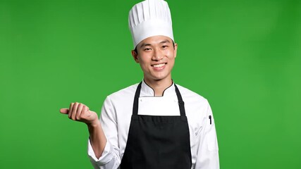 Enthusiastic Asian Chef Presenting Culinary Creations Against a Vibrant Green Screen Backdrop Perfect for Food Tutorials and Restaurant Promotions.