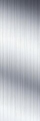 Close-up view of brushed metal showing fine parallel striations creating a soft, diffused shine,  stainless steel,  reflective