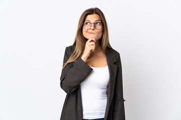 Business slovak woman isolated on white background having doubts and thinking