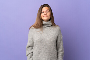 Young Slovak woman isolated on purple background having doubts while looking side