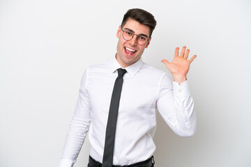 Business caucasian man isolated on white background saluting with hand with happy expression