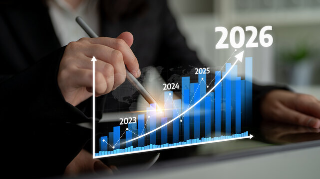 A professional hand points to a growth graph showcasing statistical trends from 2023 to 2026, representing future business projections and insights. Tessel
