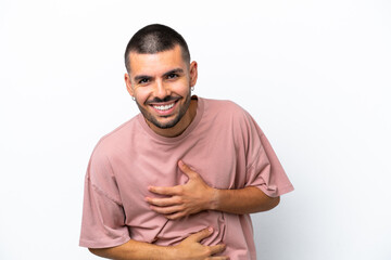 Young caucasian man isolated on white background smiling a lot