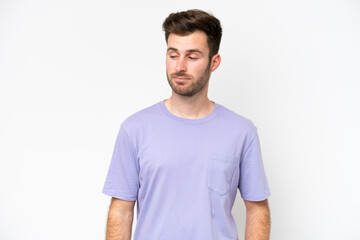 Fototapeta premium Young caucasian man isolated on white background having doubts while looking side