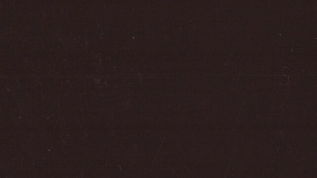 Vertical analog film grain loop with grind texture, dust and subtle imperfections. Ideal as an overlay or background for editors seeking authentic retro looks in vertical format.