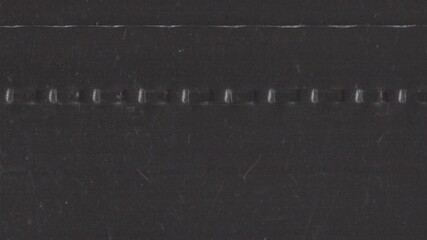 Vertical analog film grain loop with grind texture, dust and subtle imperfections. Ideal as an overlay or background for editors seeking authentic retro looks in vertical format. - Powered by Adobe