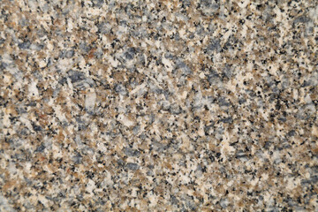 A close-up of a smooth granite stone surface.