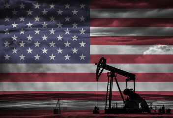 Drilling for oil in the countryside with American national flag overlay