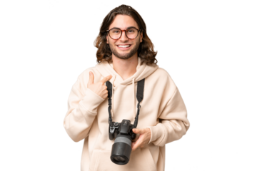 Young photographer man over isolated background with surprise facial expression