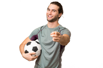 Young handsome football player man over isolated background pointing front with happy expression