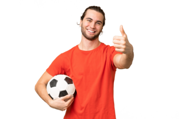 Young handsome man isolated on green chroma background with soccer ball and with thumb up