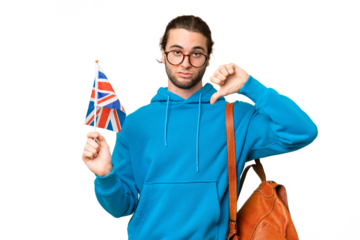 Young handsome man holding an United Kingdom flag over isolated background showing thumb down with negative expression