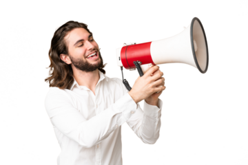 Young handsome man over isolated chroma key background shouting through a megaphone to announce something