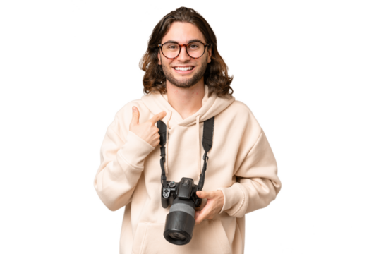 Young photographer man over isolated background with surprise facial expression