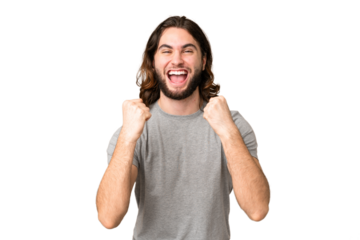 Young handsome man over isolated chroma key background celebrating a victory in winner position