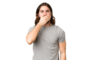 Young handsome man over isolated chroma key background covering mouth with hand