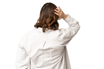 Young handsome man over isolated chroma key background in back position and thinking