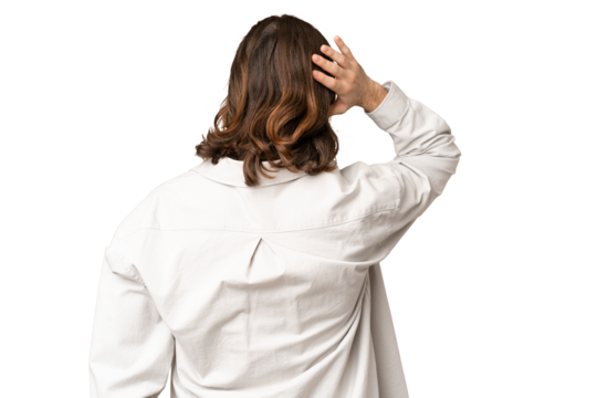 Young handsome man over isolated chroma key background in back position and thinking