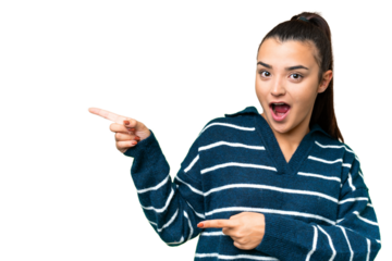 Young beauty woman over isolated chroma key background surprised and pointing side