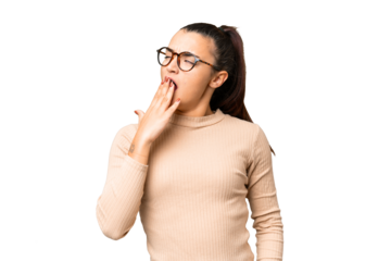 Young beauty woman over isolated chroma key background yawning and covering wide open mouth with hand