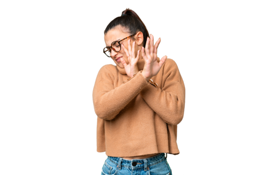 Young beauty woman over isolated chroma key background nervous stretching hands to the front