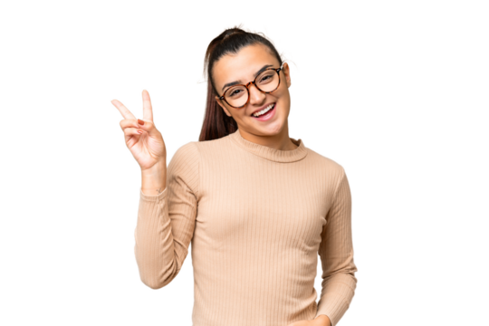 Young beauty woman over isolated chroma key background smiling and showing victory sign