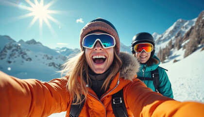 Friends enjoy winter ski trip making selfie on snowy mountain slope. Happy group wears goggles, helmets. Sunny day with blue sky and bright sun.