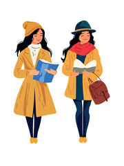 trendy young women in bright clothing holding books