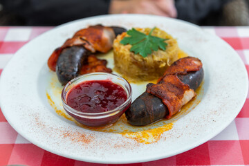 Traditional Estonian sausage meal with cabbage and sauce, Estonia.