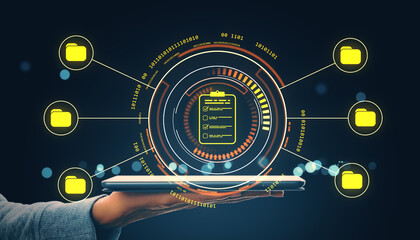 Futuristic interface showing data management concept with glowing icons and checklist hovering over tablet in hand on dark background.