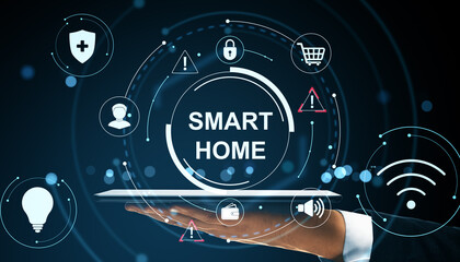 Smart home interface with IoT icons displayed on digital tablet held by person, over abstract dark blue background with glowing elements.