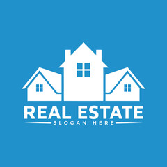 White silhouette of three houses forming a real estate logo design with text slogan on a solid blue background for property business