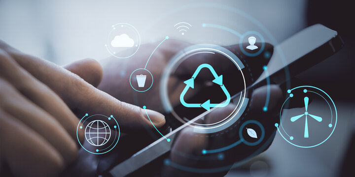 Smartphone in hand with digital recycling and eco icons on futuristic interface background representing sustainable technology use. - Powered by Adobe