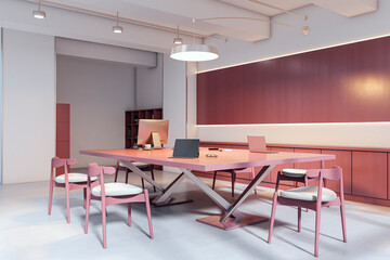 Modern coworking office with pink furniture, minimalist decor, and digital work setup in a bright, stylish interior room environment. 3D Rendering