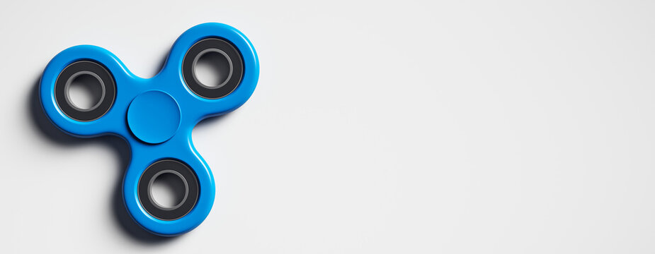 Blue fidget spinner on white background with copy space, minimal hobby concept with clean design layout and modern mockup style for banners. 3D Rendering