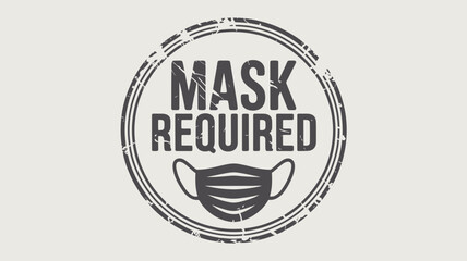 Obraz premium A circular stamp with the words mask required and a face mask illustration in a grunge style design