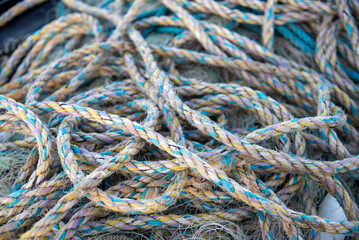 collection of colorful fishing ropes tangled together