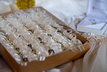 Wedding favors in box with ribbon bows and necklace