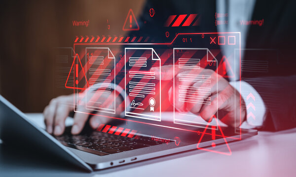 Cybersecurity threat detection concept with digital document warning symbols over businessman using laptop on futuristic interface background.