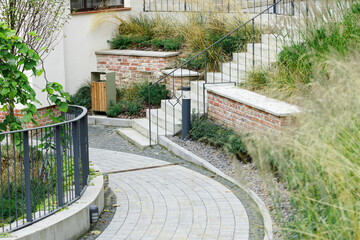 landscaped park square paved track around plant flower bed concrete landmark place pavilion
