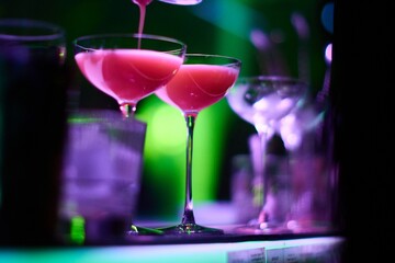 Bartender Preparing Cocktails at a Bar Counter	
