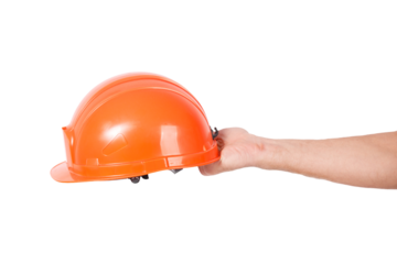 A person holds an orange hard hat on a white background, ready for work or construction
