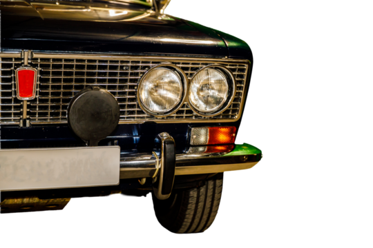A close-up shot of a car's front end, with details visible