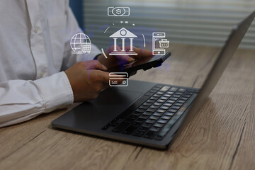 Person using mobile banking on smartphone and laptop with digital finance icons, representing online payments, secure transactions fintech innovation, global digital banking solutions