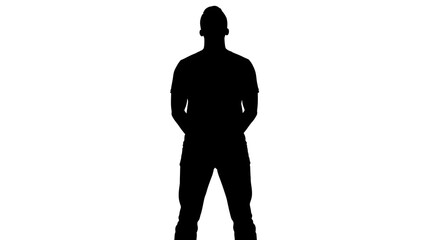 Fototapeta premium Silhouette of a man standing with hands behind his back against a white background in a studio shot