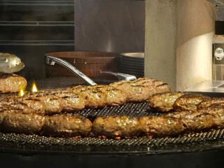 Hamburg steak patty searing on a hot barbecue grill