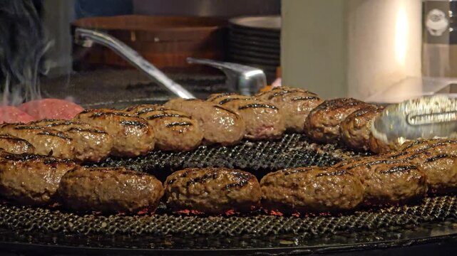 Hamburg steak patty searing on a hot barbecue grill